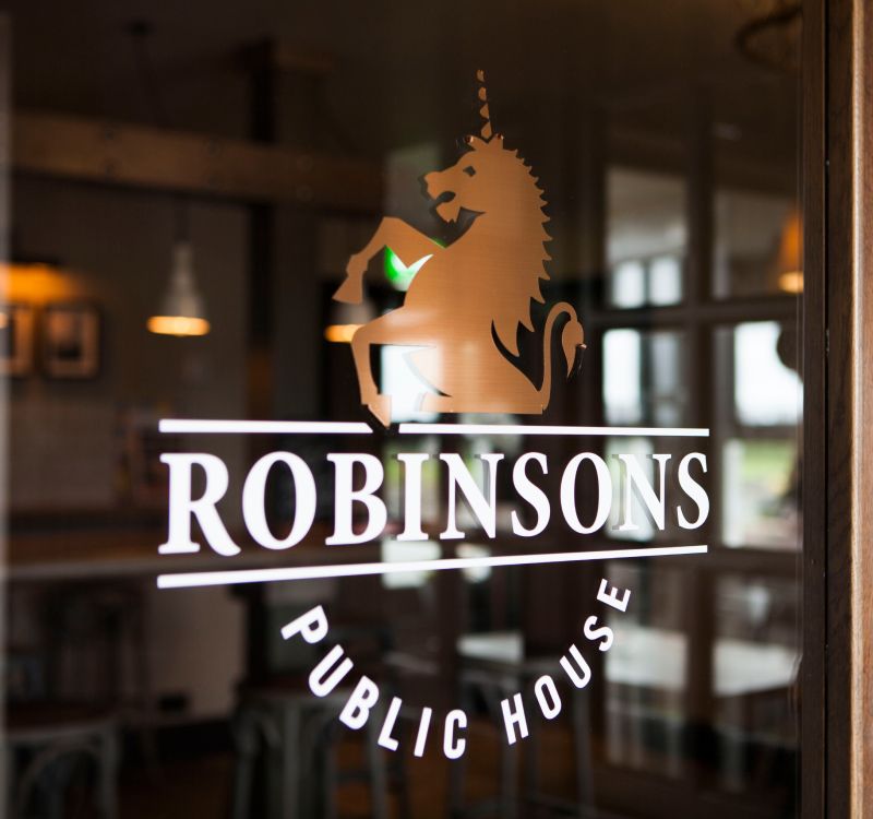 A window with the Robinsons logo on.